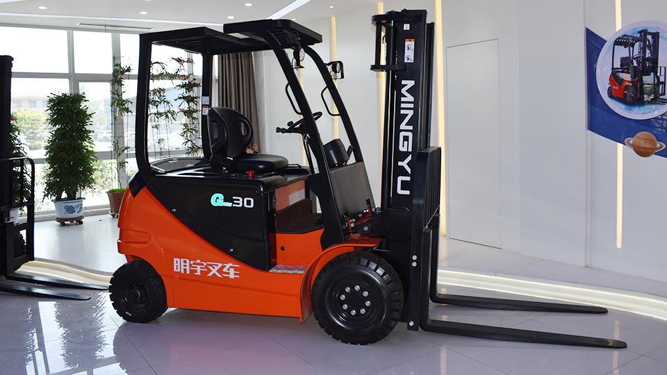 Where is an unloaded electric forklift center of gravity generally located?